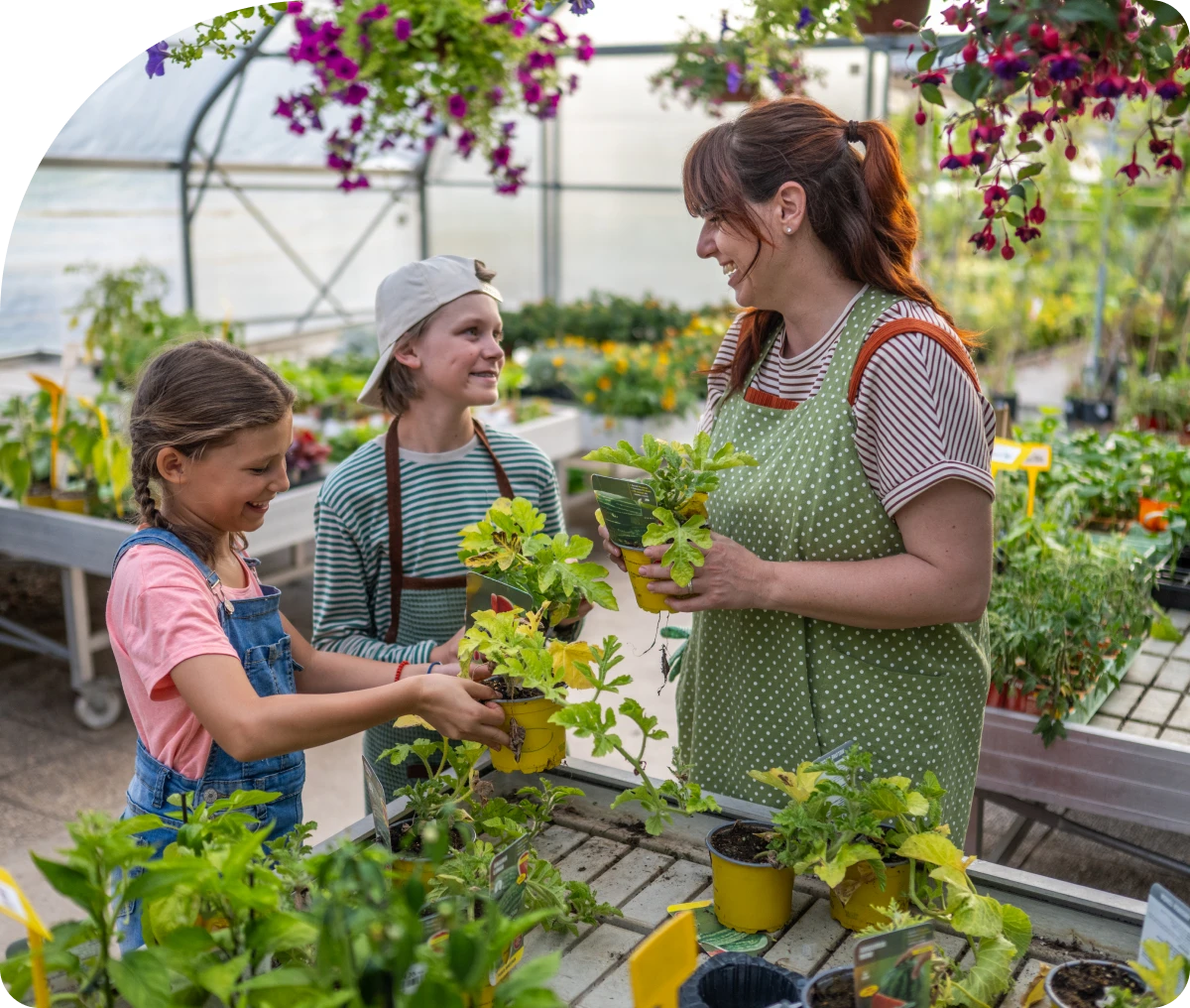 People gardening in a greenhouse